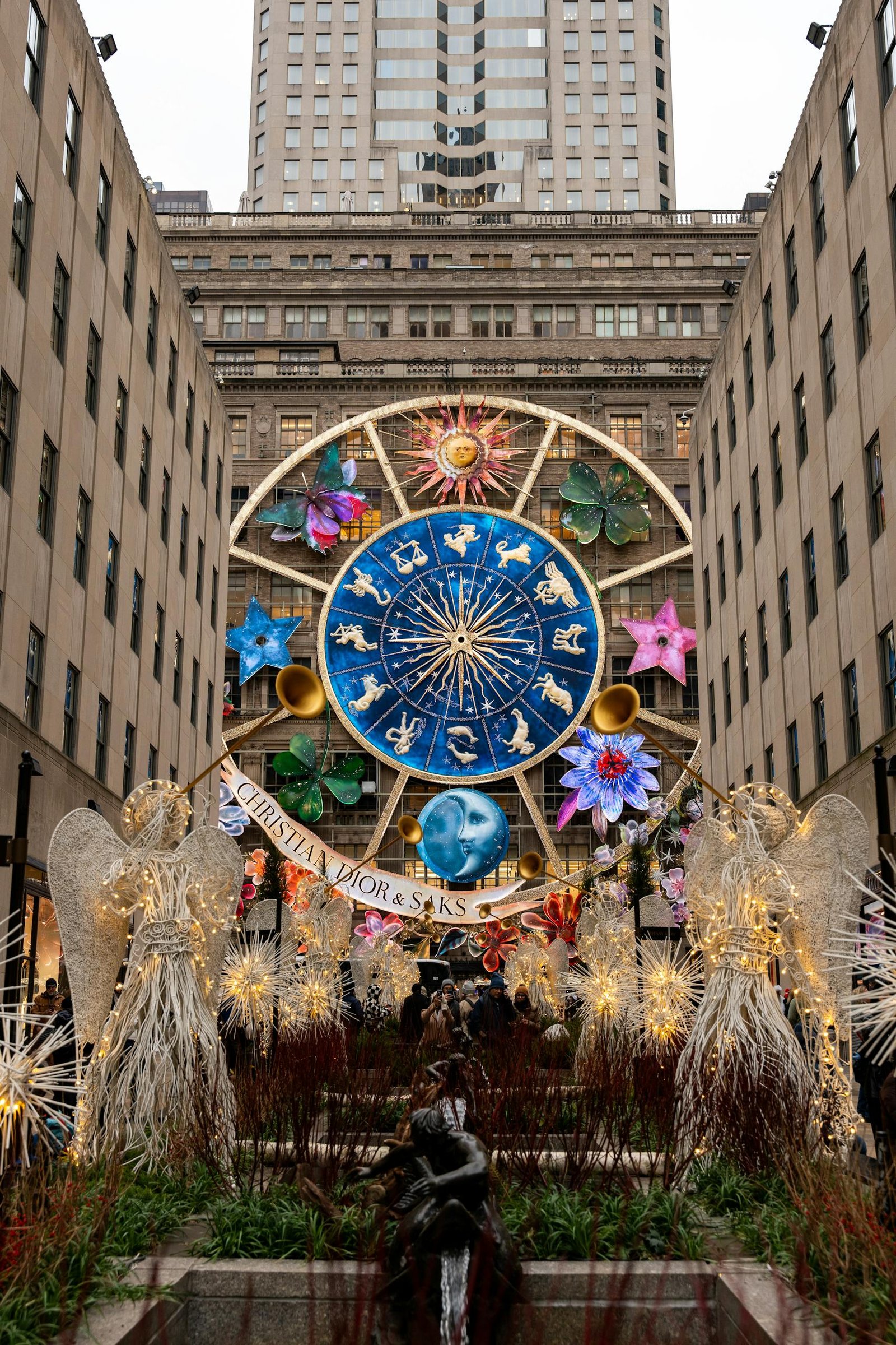 Vibrant holiday decorations featuring zodiac symbols at Rockefeller Center, New York City.